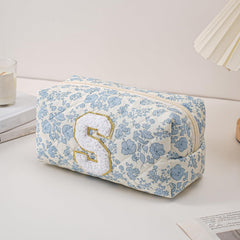 Etui maquillage bleu fleuri JOVAKIT, rangement coquet et utile.