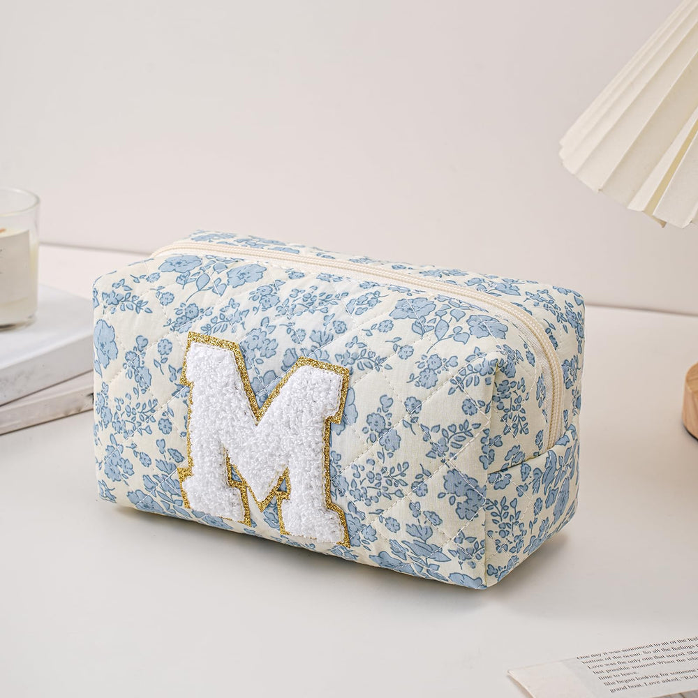 Sac JOVAKIT Alphabet fleuri bleu avec fermeture zippee, organisation sécurisée en voyage.