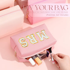 Pochette de toilette Kigeli en PU rose, parfait compagnon de voyage.