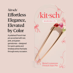 Barrette Kitsch en or avec gemmes roses, apporte une touche chic en soirée.