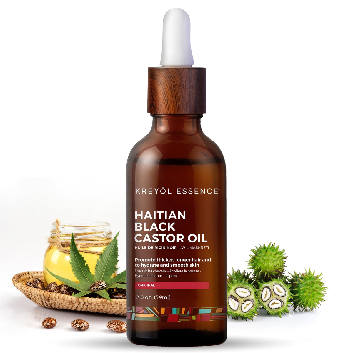 KREYÒL ESSENCE huile noire de ricin haïtienne dans une bouteille en verre pour cheveux plus forts.