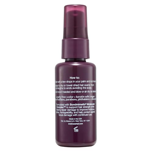 Mains appliquant le sérum Kristin Ess Peptide Restore pour nourrir les longueurs.