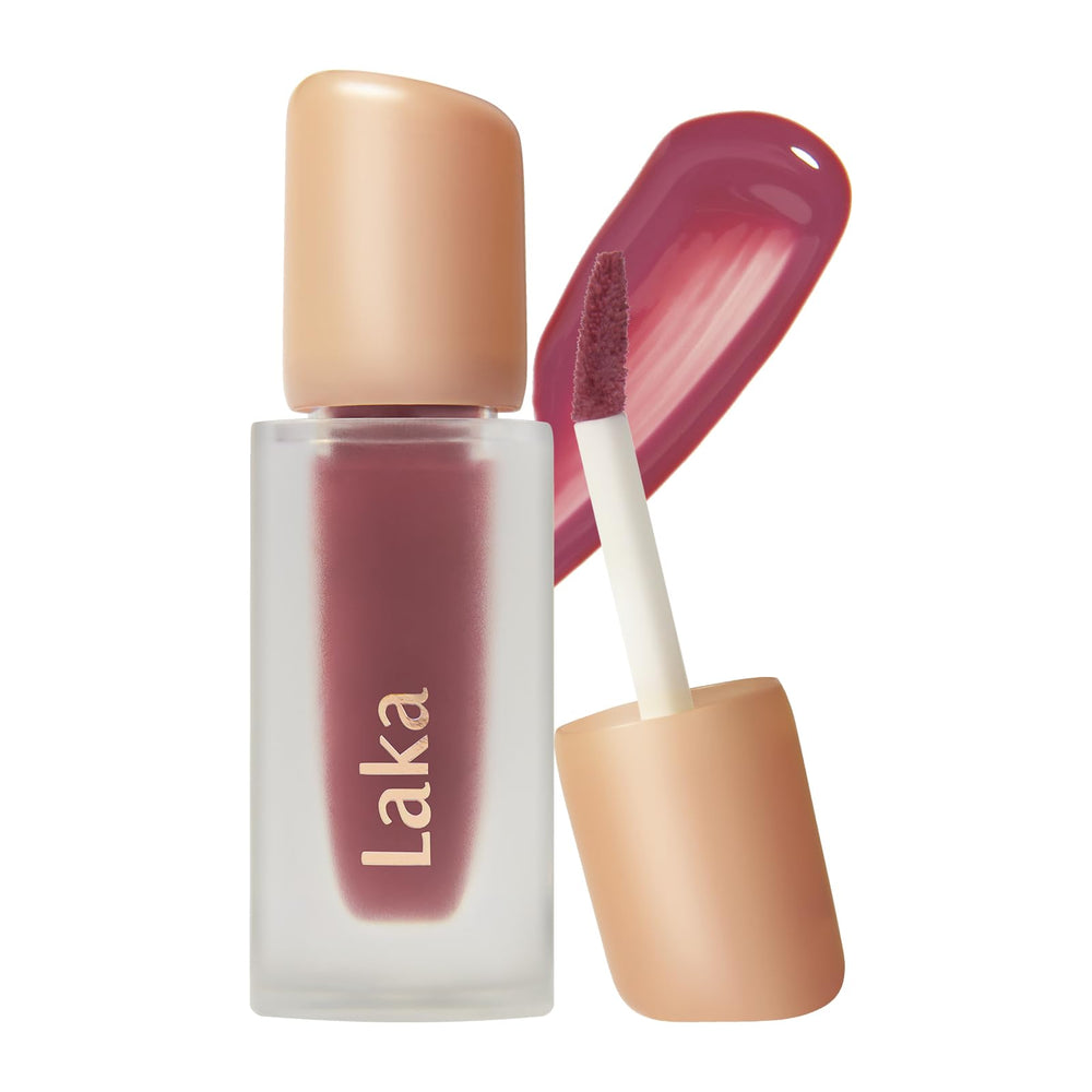 Laka Fruity Glam Tint – Bouteille brillante offrant un éclat lumineux.
