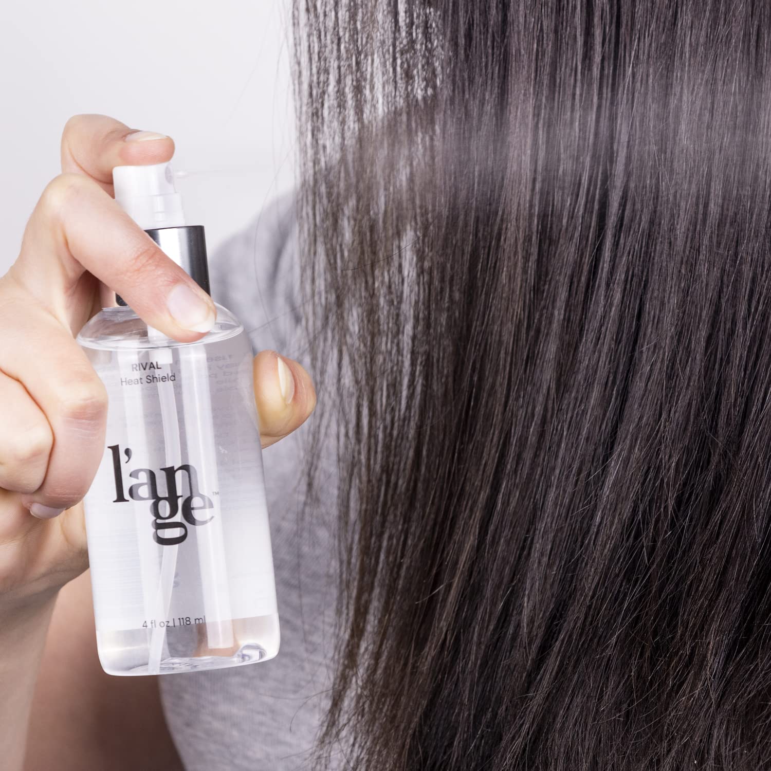 Hair with Rival Heat Shield delivers a radiant, smooth finish.