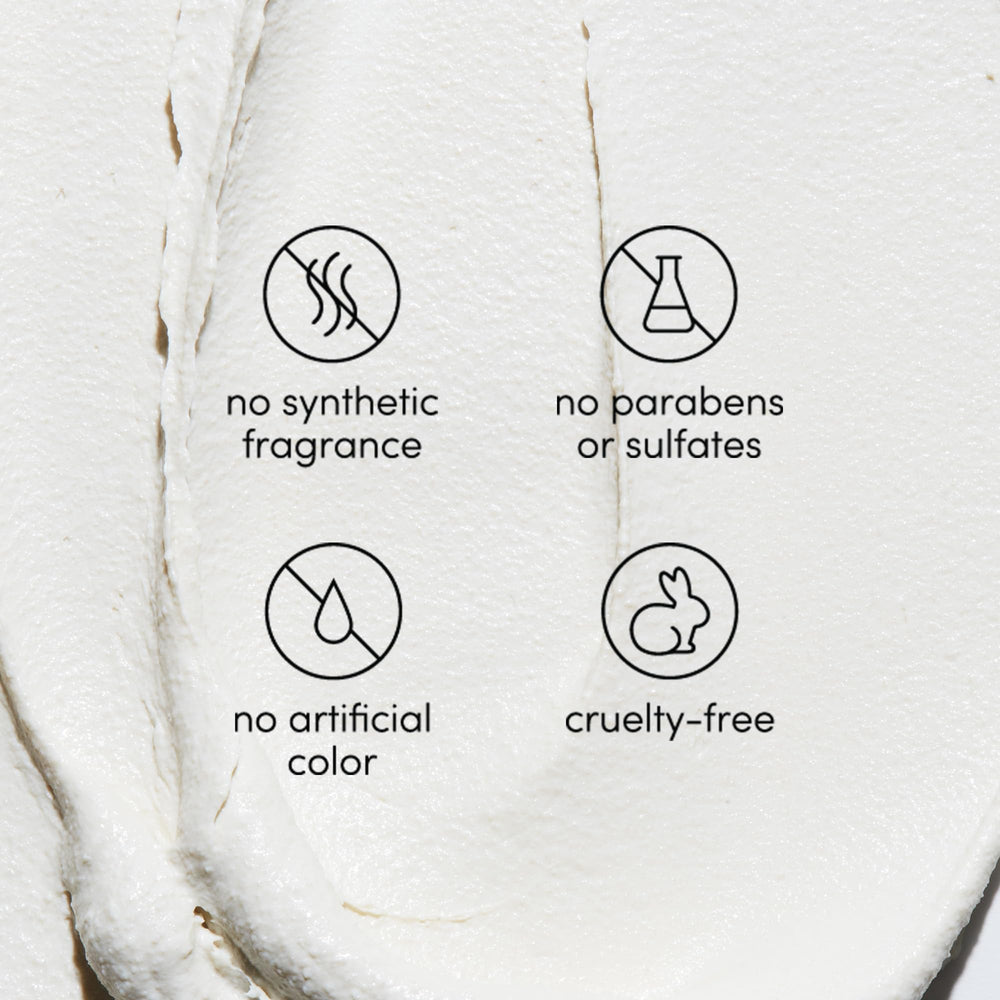 Bottle featuring natural ingredients and essential oils on shelf.