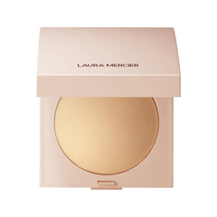 Laura Mercier Poudre finissante lumineuse compacte pour un éclat naturel.