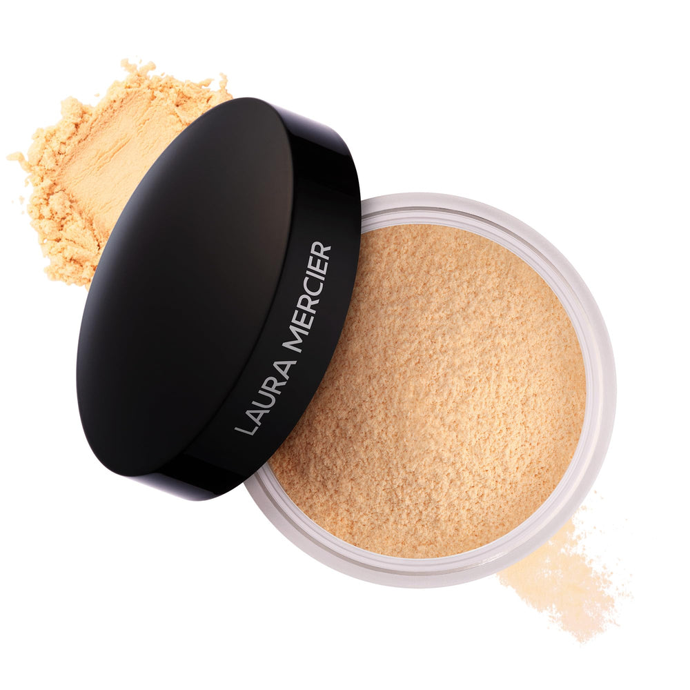 Laura Mercier poudre libre translucide teinte miel, fini naturel et tenue longue durée.