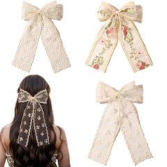 LFOUVRE Noeud dentelle beige à fleurs brodées, idéal pour une coiffure élégante.