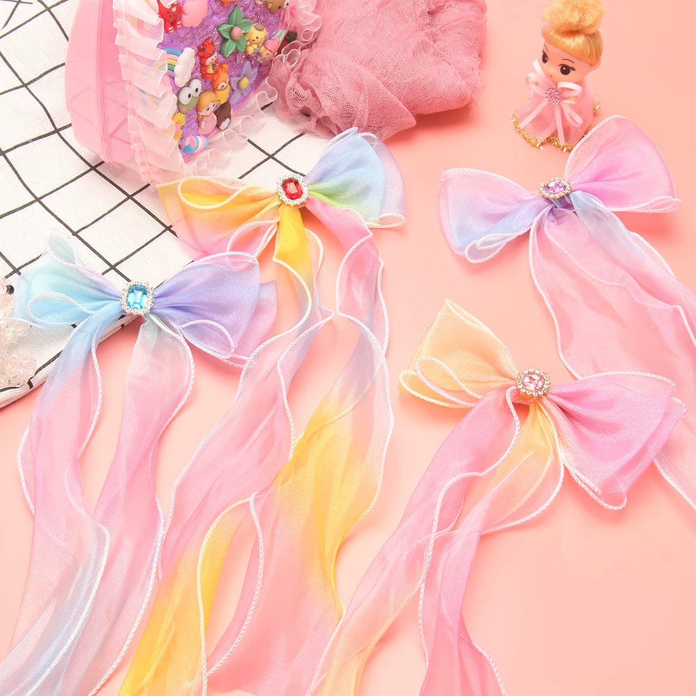 Little World clips noeud ruban orange, ajoute une touche vive au style.