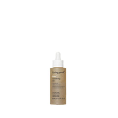 Living Proof No Frizz Vanishing Oil – bouteille élégante, anti-frisottis et brillance légère.