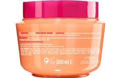 Parfum aquatique du masque Elvive Dream Long, application douce et démêlage facilité.