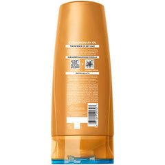 Pouring L'Oreal Paris Elvive Extraordinary Oil conditioner reveals silky, lightweight nourishment
