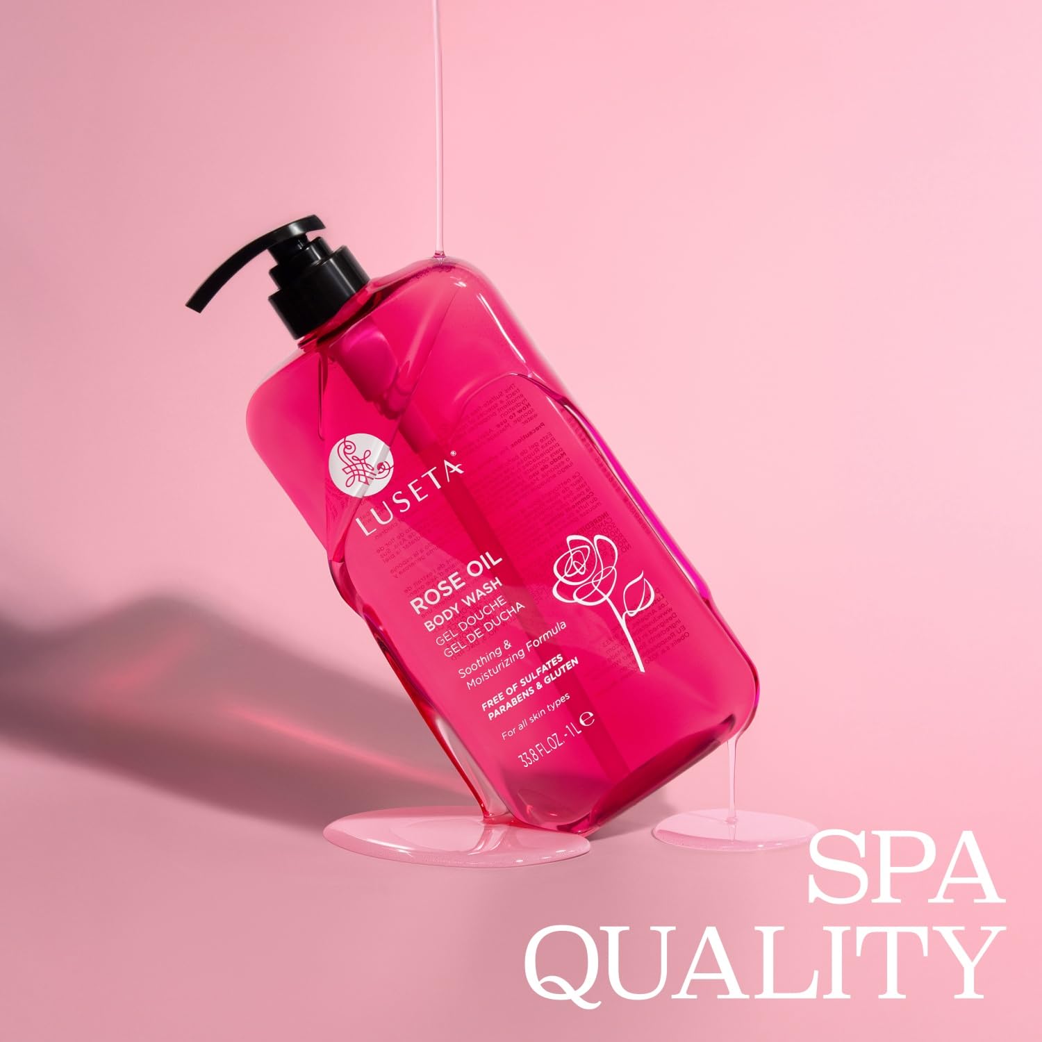 Luseta Rose Oil Body Wash bottle on marble countertop evokes spa vibes