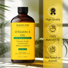 Majestic Pure huile vitamine E appliquée sur le visage, peau satinée.