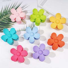 Pinces-majomi fleurs matte jaune idéales pour accessoiriser et rester en place.