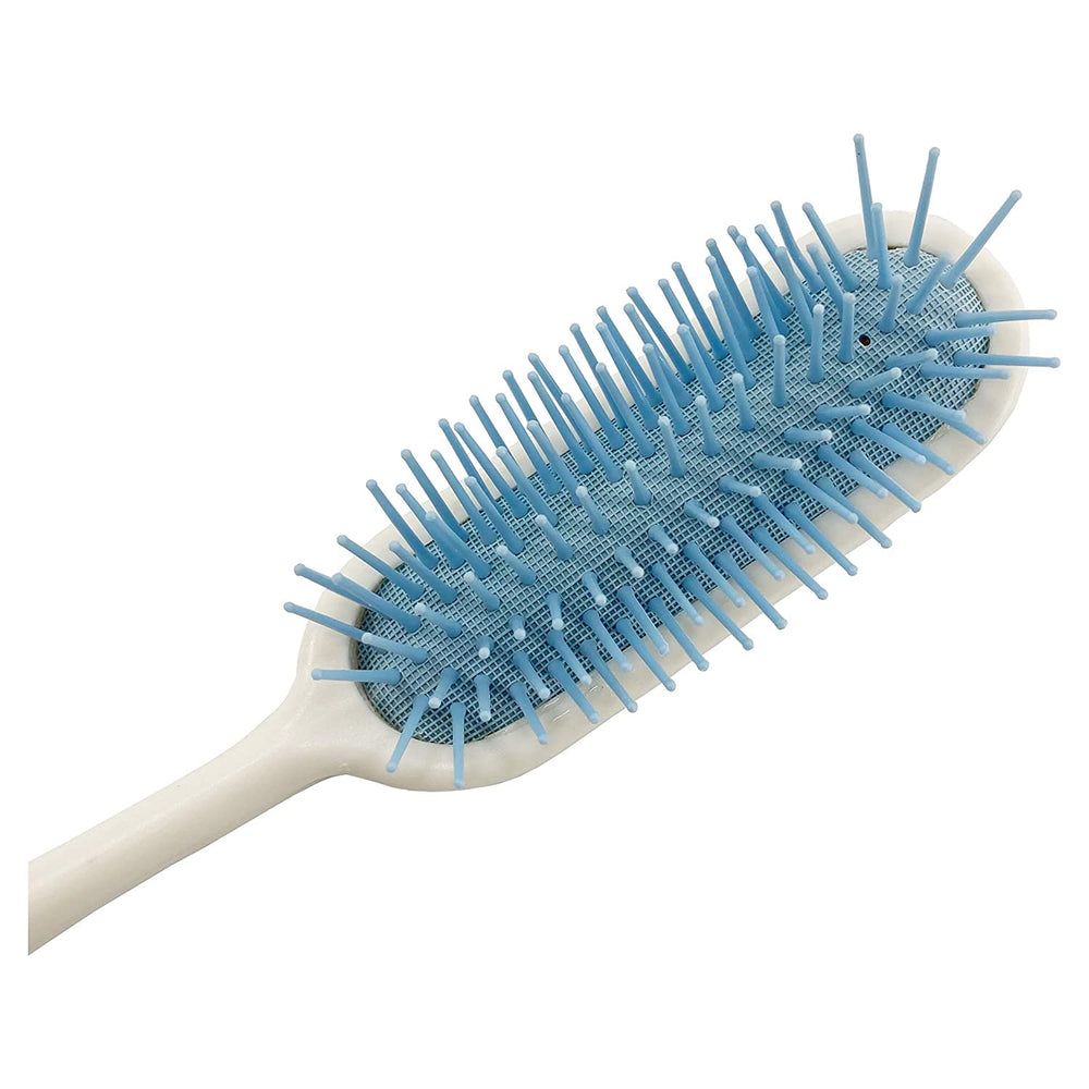 Brosse Makihoma avec poignée en caoutchouc pour une prise sûre.