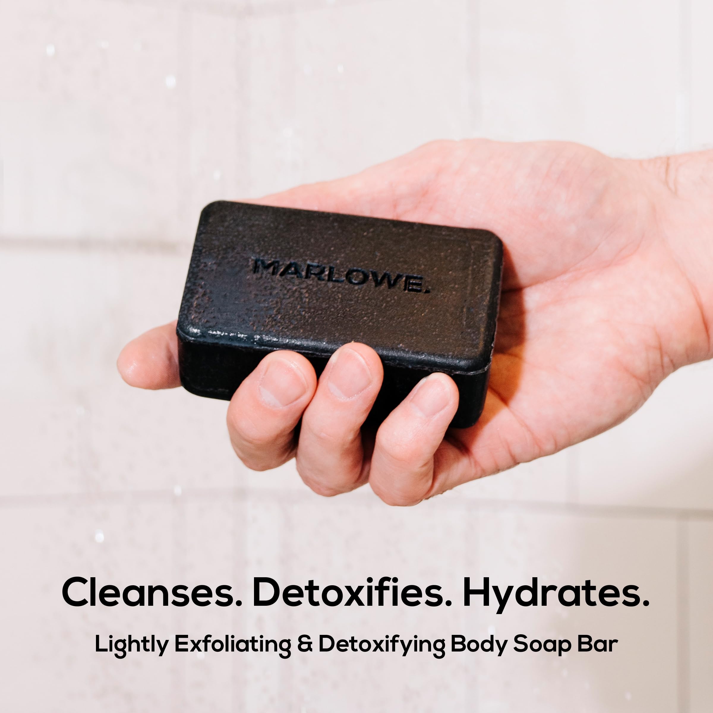 MARLOWE No. 106 charcoal soap bar closeup lather highlights gentle exfoliation and smooth skin