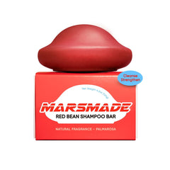 Shampoing-barre Mars Made montrant la brillance naturelle du haricot rouge.