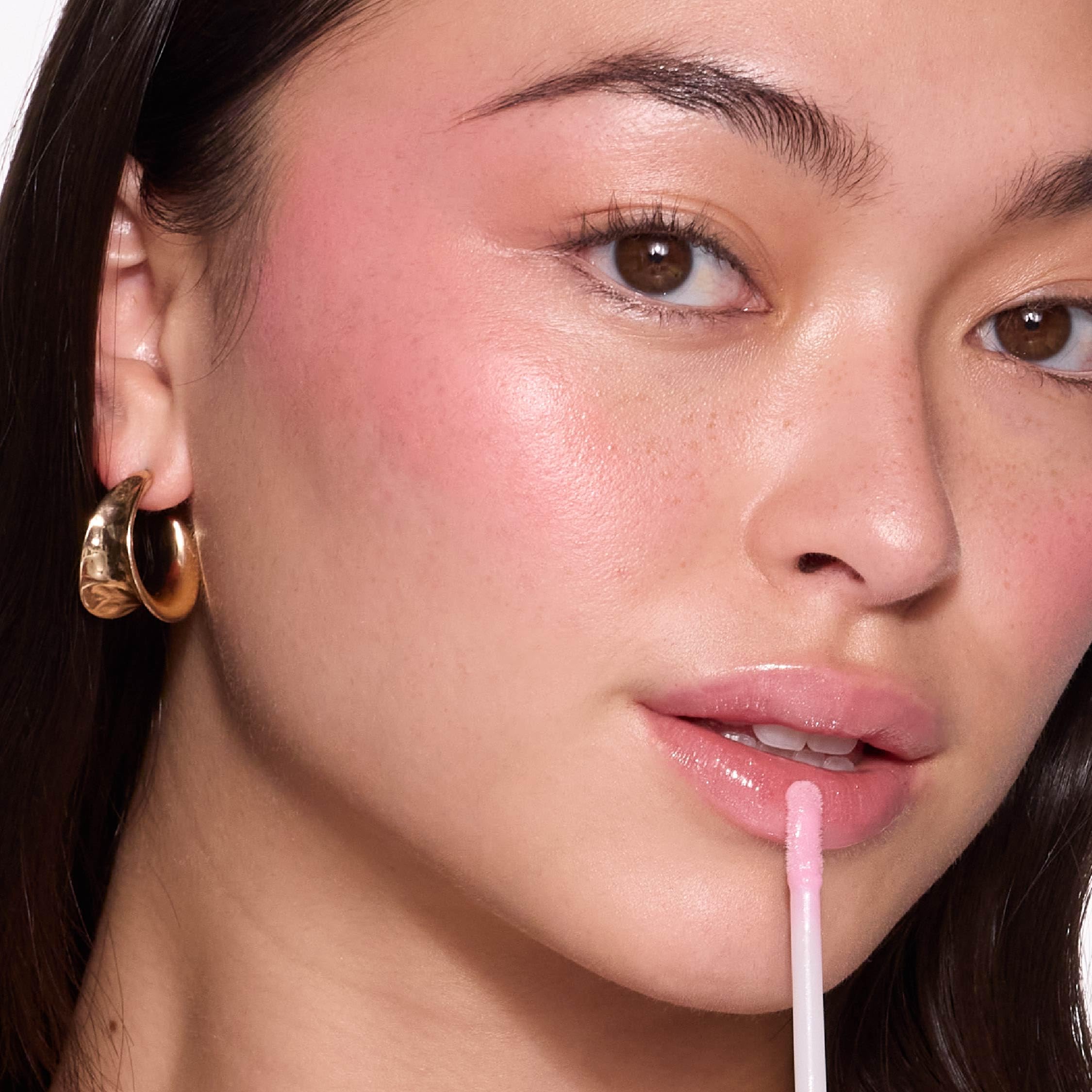 Lip Lights Shine Gloss avec lampe integree et miroir pour retouches en déplacement.