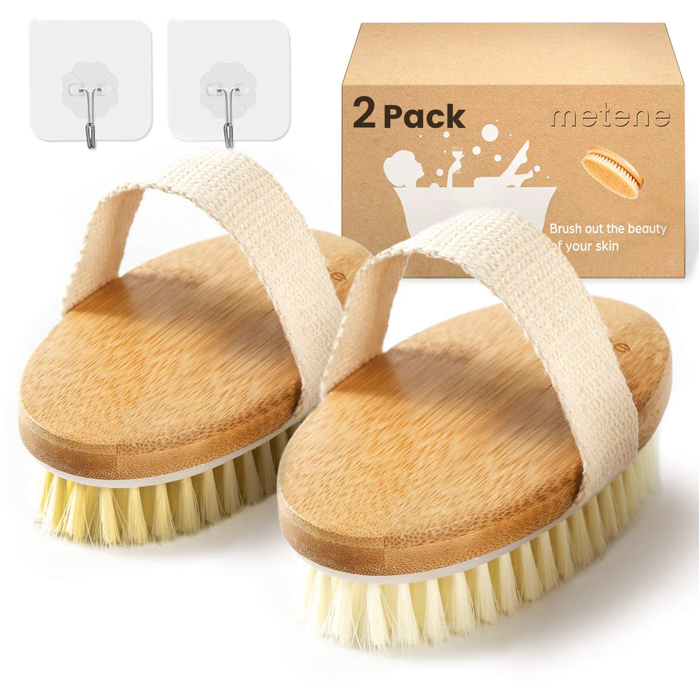 Brosse Metene corps rigide avec brins naturels pour exfolier en profondeur.