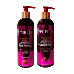 Mielle Organics Pomegranate & Honey shampoo-bouteille démêle les cheveux et laisse de la douceur.