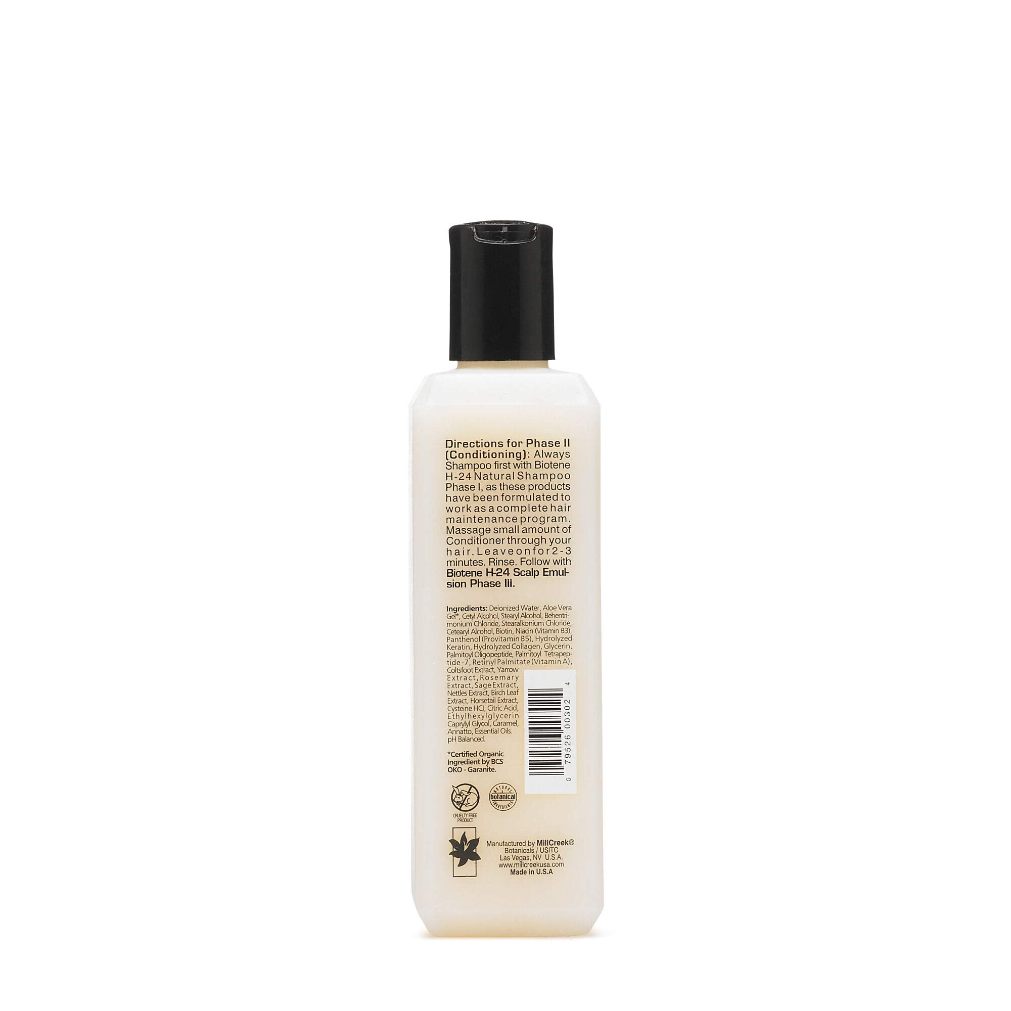 Mill Creek Biotin H24 conditioner tube close-up highlighting rich texture.