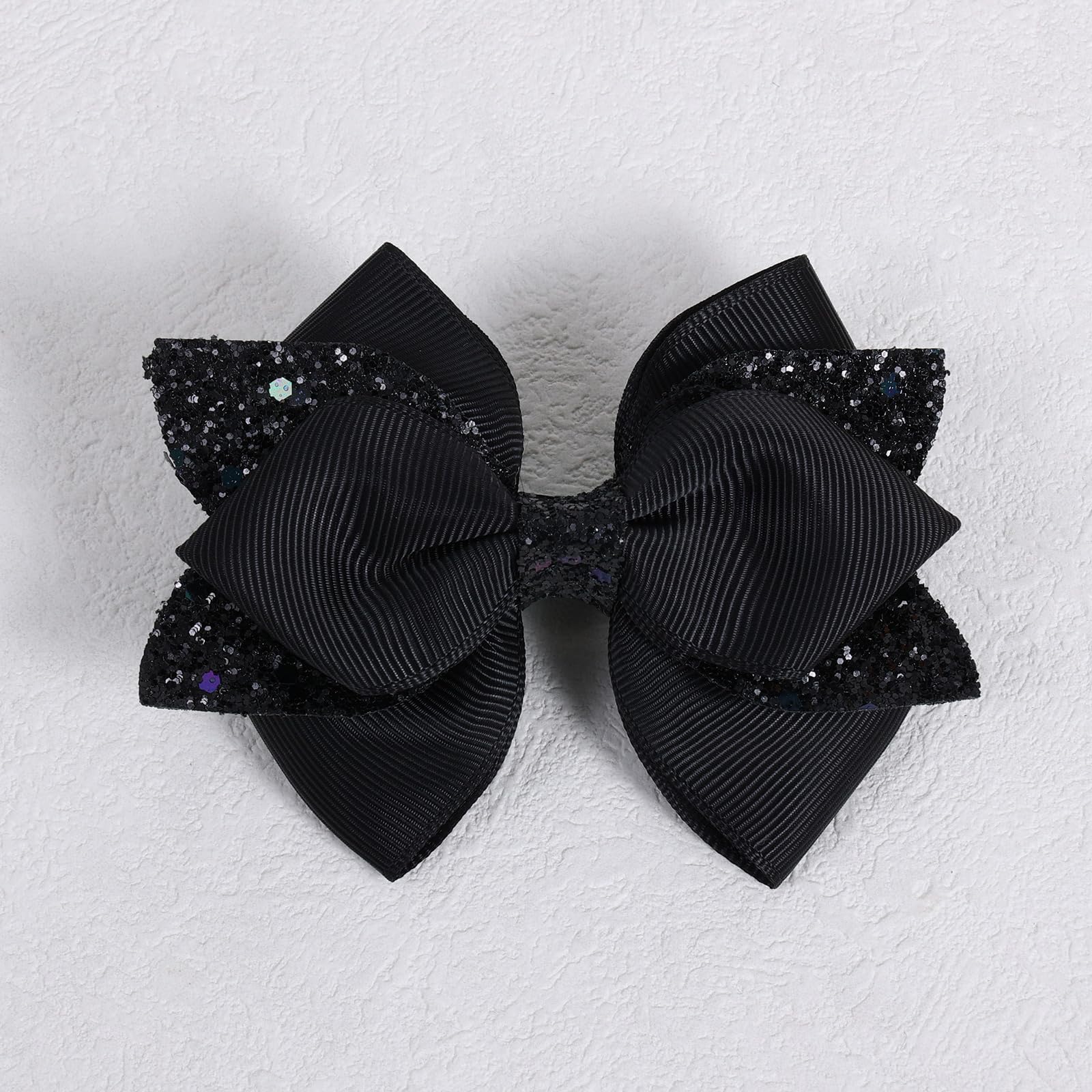 Barrette Miroksh ruban noir brillant, adaptée à tous types de cheveux.