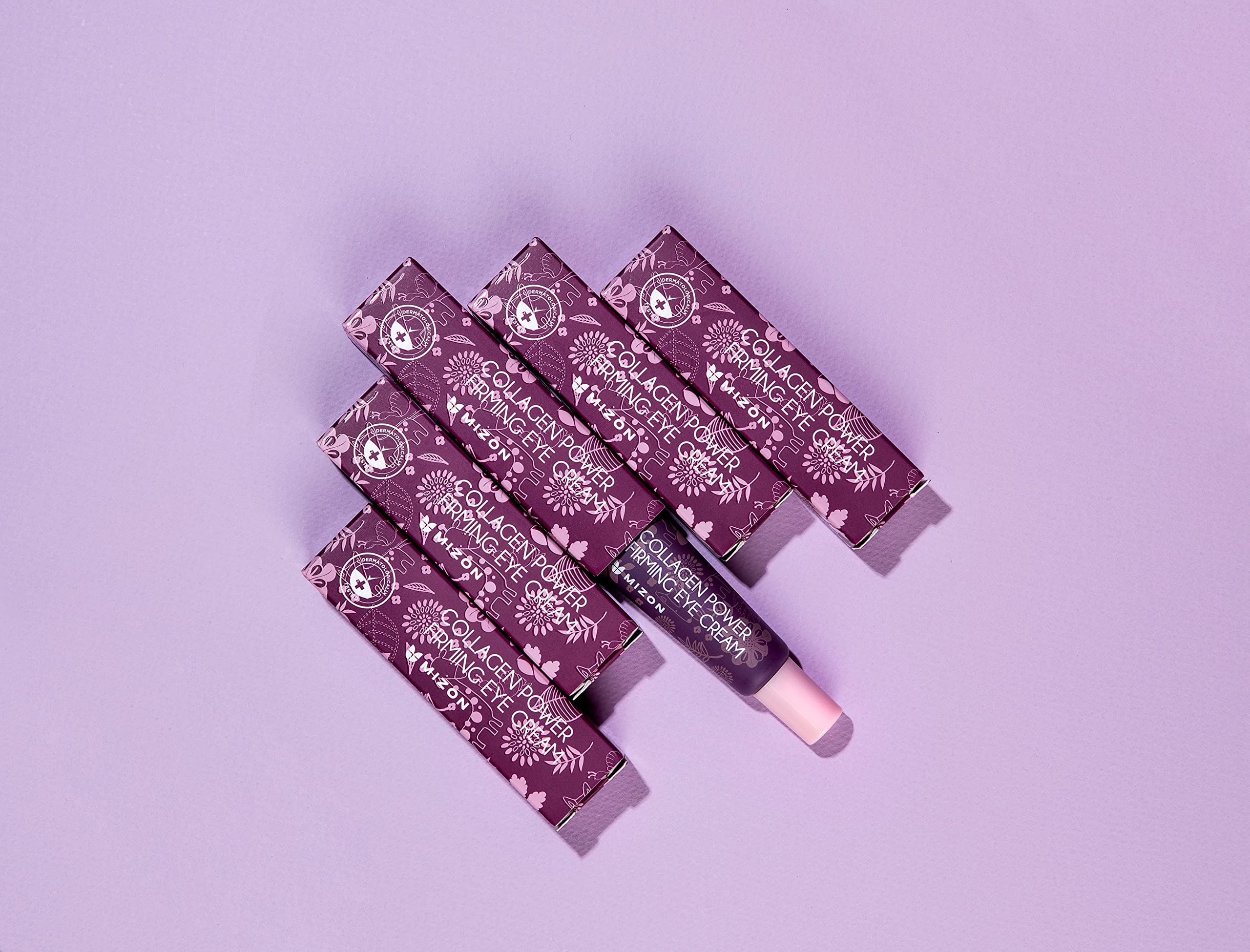 Crème yeux MIZON, texture crème à absorption rapide pour une peau hydratée.