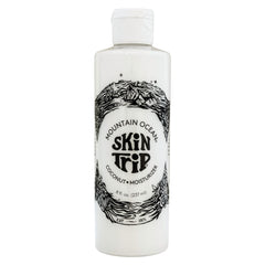Mountain Ocean Skin Trip Lotion pour le corps coco, bouteille élégante prête pour hydratation rapide.