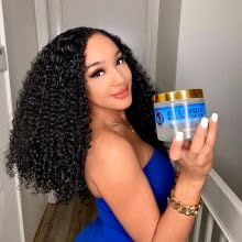 Nefertiti's Secrets – Contrôle du frisage et brillance naturelle des boucles.