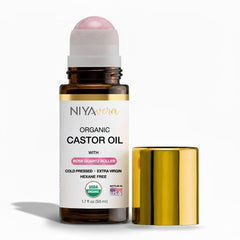 NIYAVERA organic castor oil with rose quartz roller for facial nourishment.