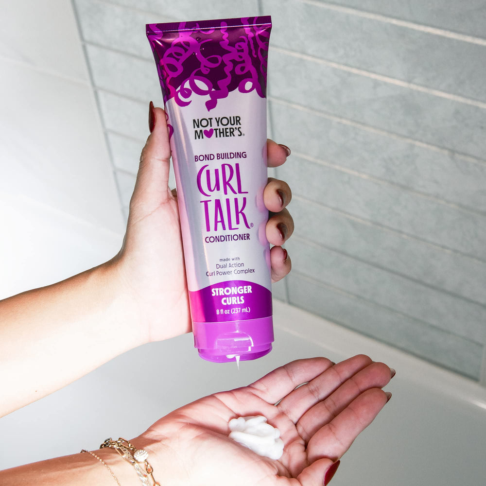 Not Your Mother's Curl Talk Bond Building Conditioner being applied for detangling and frizz control.