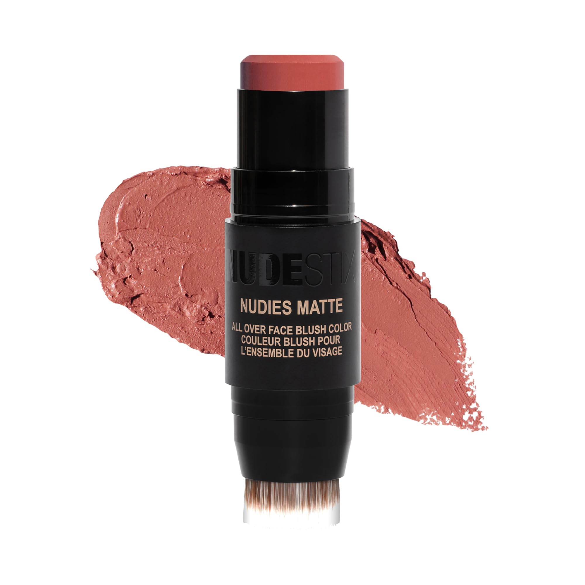 Nudestix Nudies Blush Stick dans sa boîte métallique recyclable prête pour le voyage.