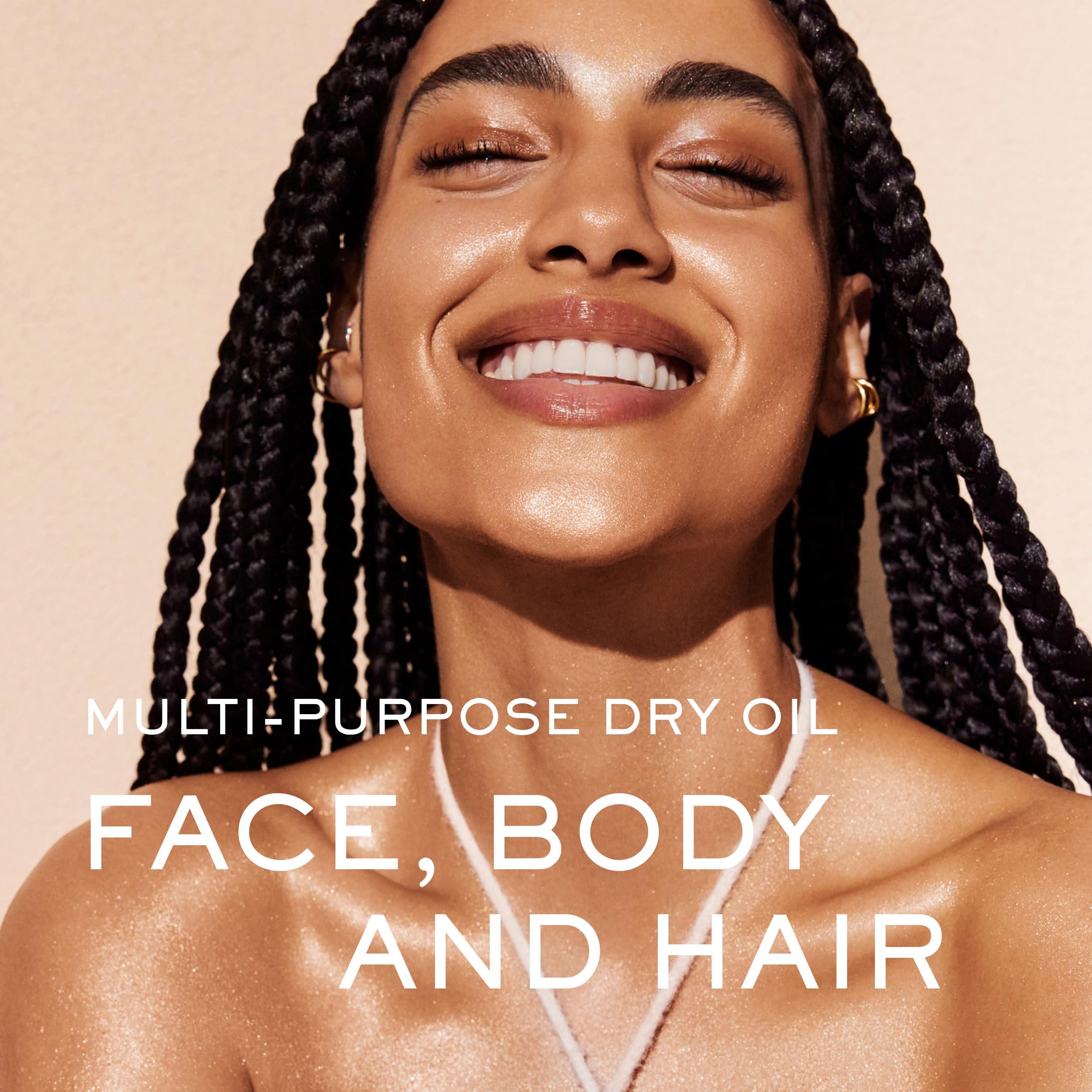 Nuxe Huile Prodigieuse Shimmer — gouttes perlées visibles apportant un effet nacré sur la peau.