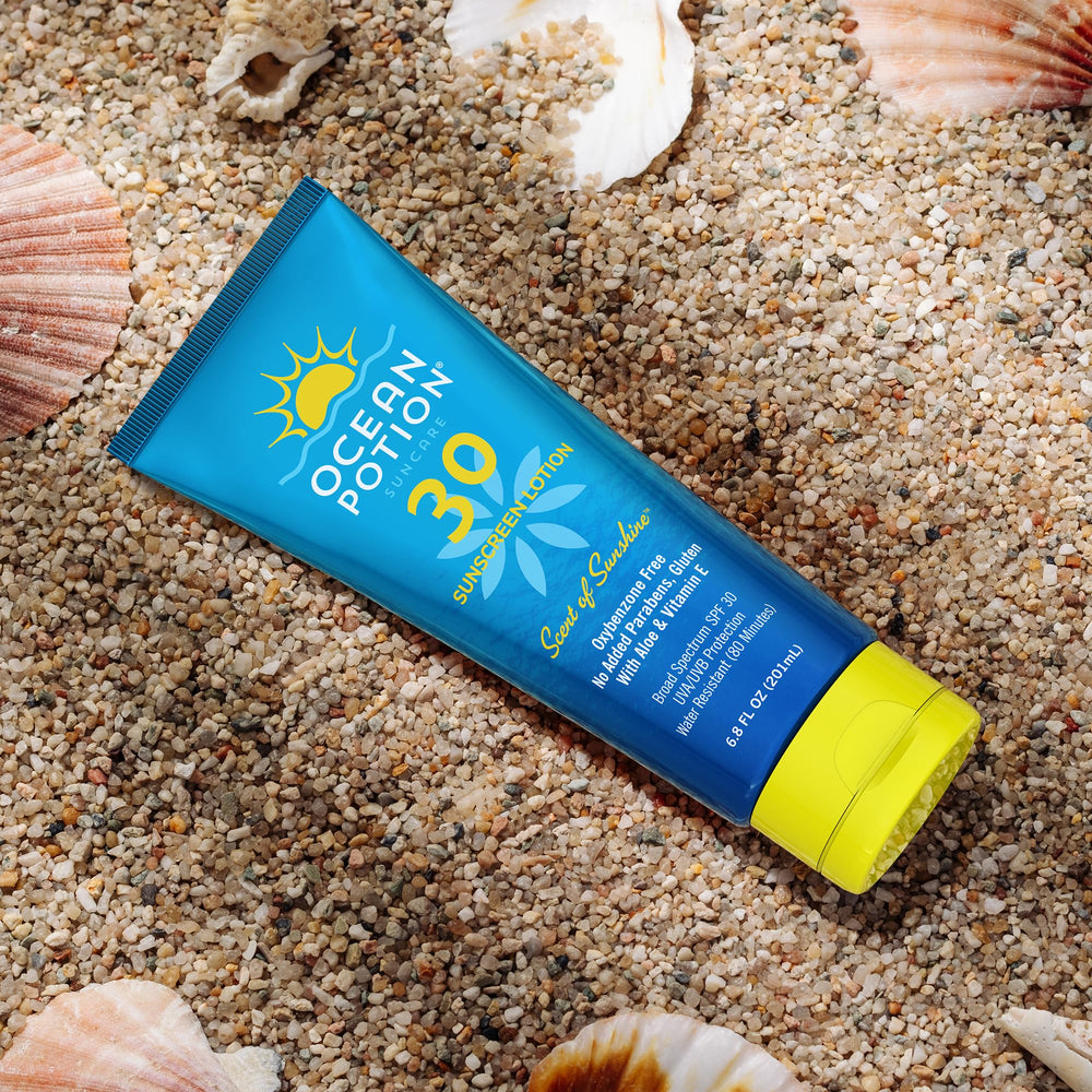 Ocean Potion Sunscreen Lotion on a sunny beach setup for outdoor days.
