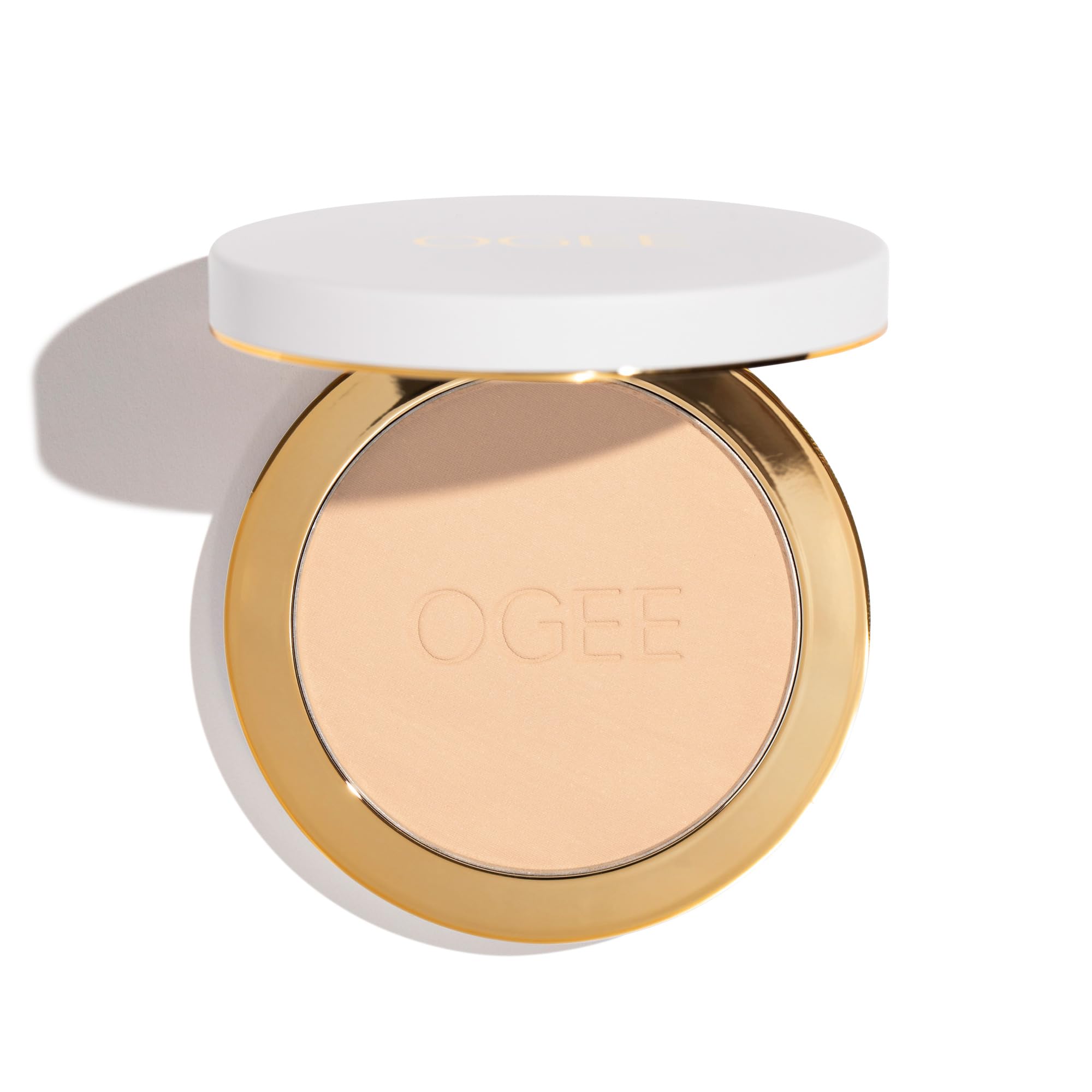 Ogee poudre-set sable avec étui inclus, rangement pratique et prêt à l'emploi.