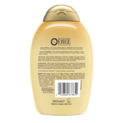 Close-up of lather from OGX shampoo emphasizing coconut oil and coffee extract nourishment.