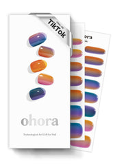 Bandes gel semi-cuits ohora dégradé bleu sur ongles, tenue possible jusqu'à deux semaines.