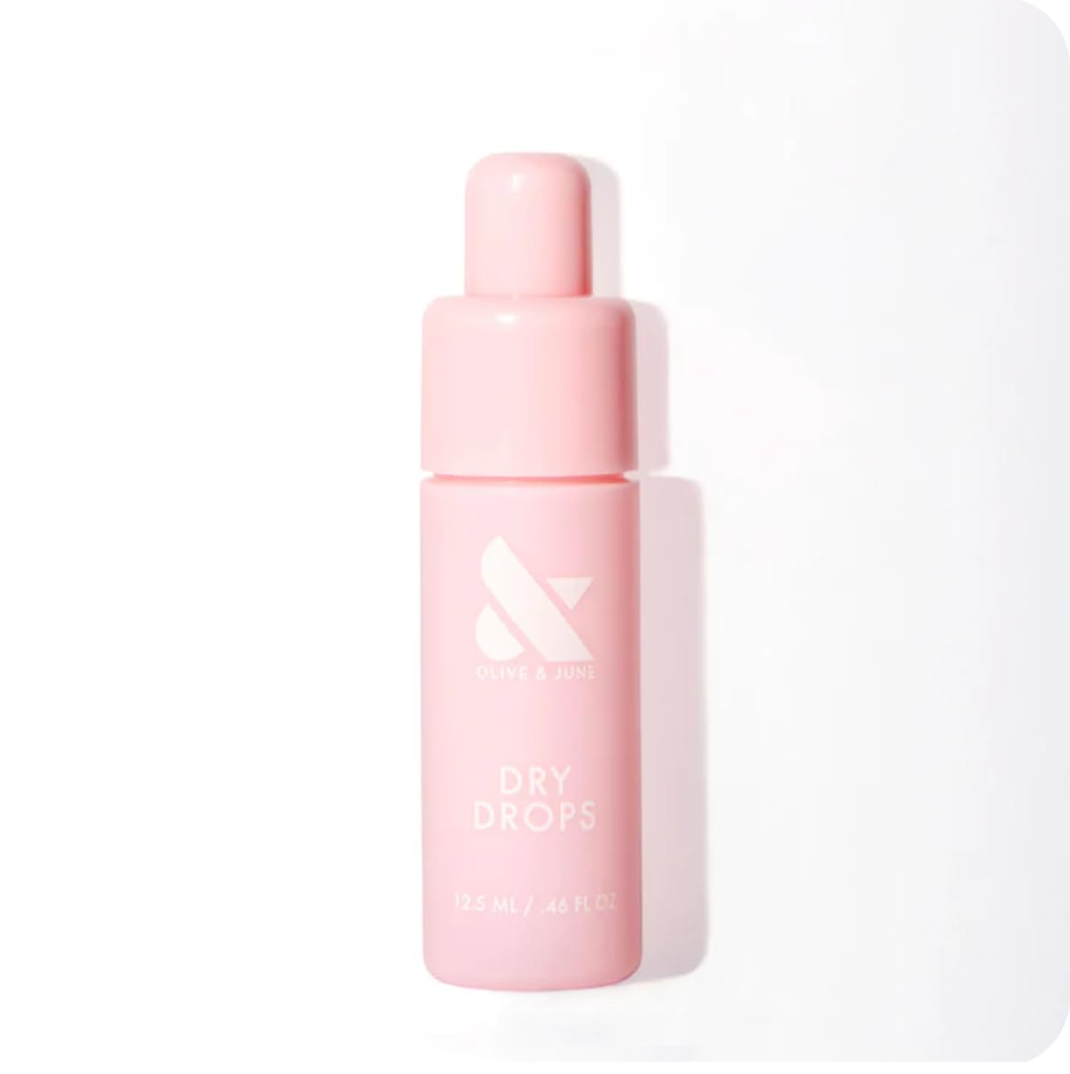 Olive & June Dry Drops, bouteille pocket, application rapide et pratique d'une seule main.