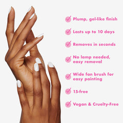 Application du vernis Olive & June longue durée en 2–3 couches pour une couleur riche.