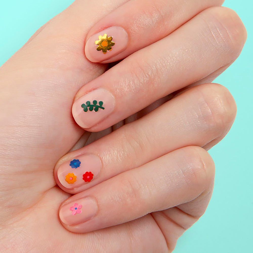 Omy Fleurs : motifs variés et colorés pour fêtes et cadeaux.