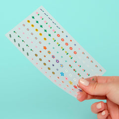 Omy Fleurs, stickers brillants et imperméables pour activités quotidiennes.