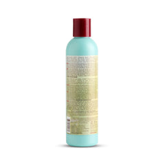ORS Hairrestore Shampoing, action de versement fluide pour démêlage.
