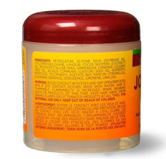 ORS Huile de jojoba sur cheveux, brillance naturelle et coiffage facilité.