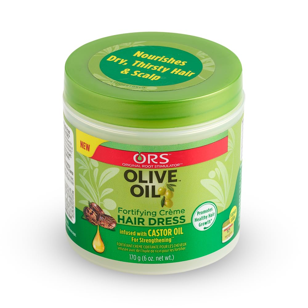 Applying ORS Creme to damp hair as part of routine