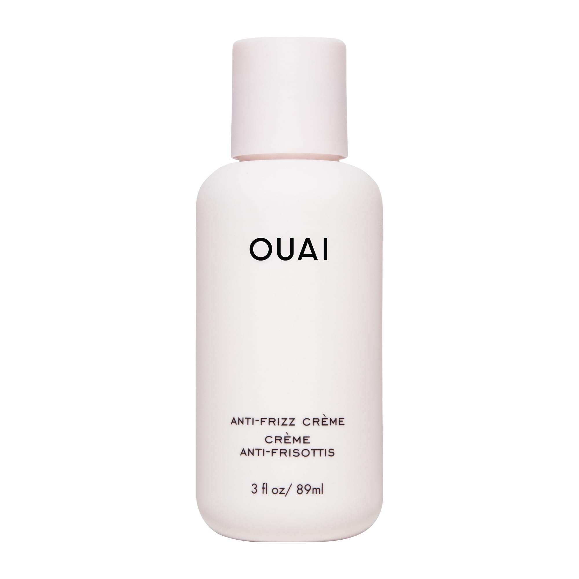 OUAI Crème Anti-Frizz Voyage: bouteille compacte pour cheveux lisses et sans frisottis.