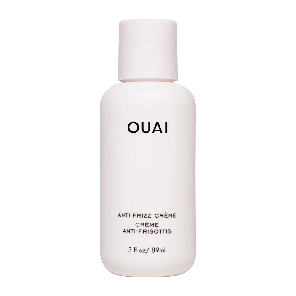 OUAI Crème Anti-Frizz Voyage: bouteille compacte pour cheveux lisses et sans frisottis.