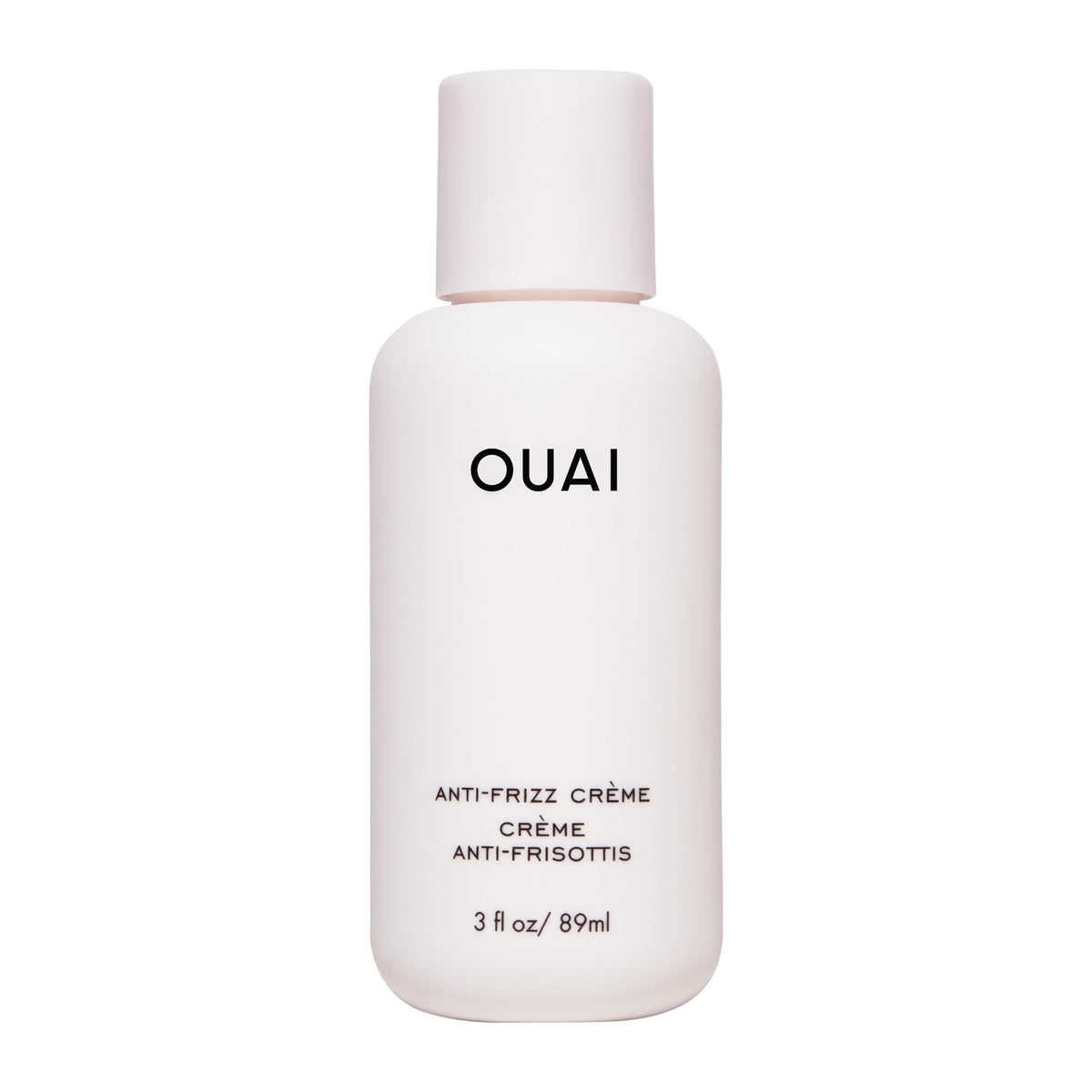 OUAI Crème Anti-Frizz Voyage: bouteille compacte pour cheveux lisses et sans frisottis.
