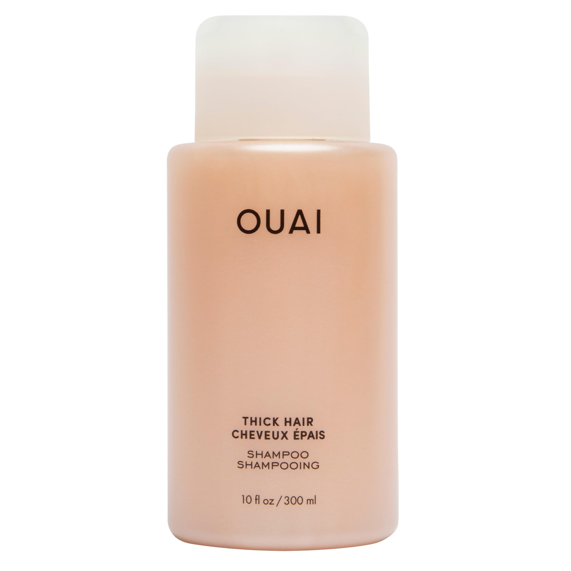 Shampooing OUAI épais: bouteille brillante prête à hydrater les cheveux.