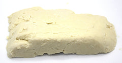 Our Earth's Secrets Ivory Shea butter close-up showing creamy texture for nourishing skin.